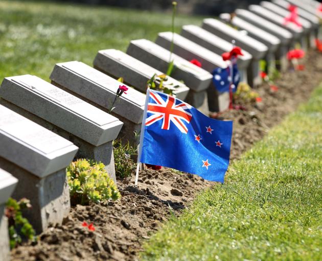 A New Zealand flag flutters among the headstones at Ari Burnu Cemetery on the Gallipoli Peninsula...