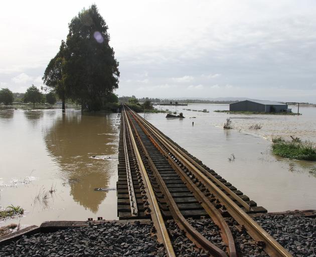 The railway line surrounded by water near Balclutha yesterday morning. Photo: John Cosgrove