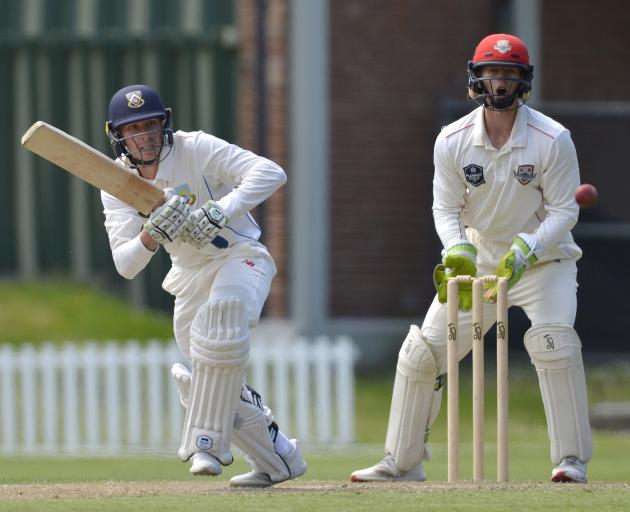 Otago’s Cam Hawkins runs a quick single while Canterbury wicketkeeper Cameron Fletcher looks on...
