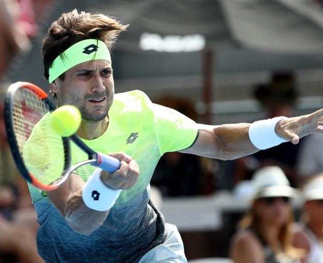 David Ferrer plays a forehand in yesterday's quarterfinal at the ASB Classic. Photo: Getty Images