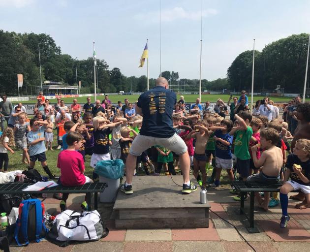 Eben Joubert teaches Dutch children the haka at a rugby club in the Netherlands. Photo: Supplied 