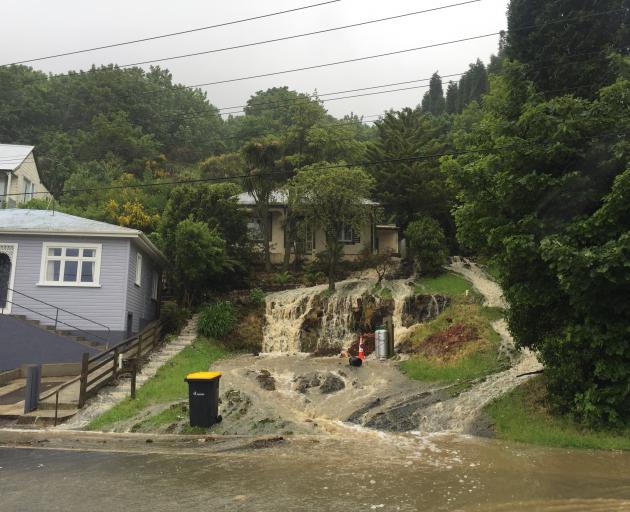 The front of this house in Ravensbourne turned into a torrent. Photo: Gregor Richardson