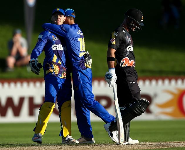 Michael Rippon hugs keeper Ben Cox, who put in a star performance while Luke Woodcock dejectedly...