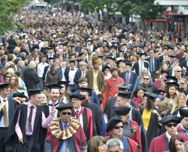 University of Otago graduands walk along George St, Dunedin, in a graduation parade before yesterday's two graduation ceremonies at the Dunedin Town Hall. Photo: Gerard O'Brien