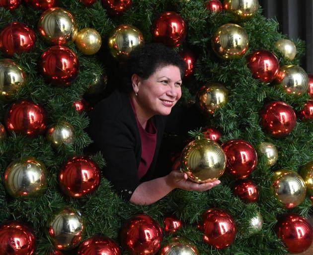 Dunedin City Council community development and events manager Joy Gunn is surrounded by council-owned Christmas wreaths and garlands. Photo: Linda Robertson