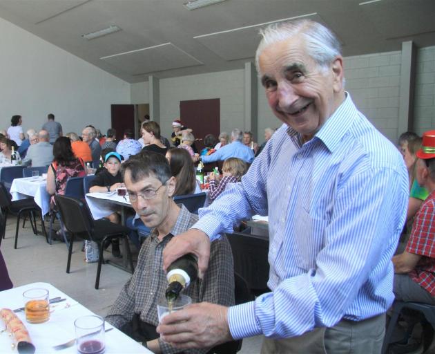 Michael Cresswell, of Oamaru, makes sure everyone at his table has a drink before the start of...