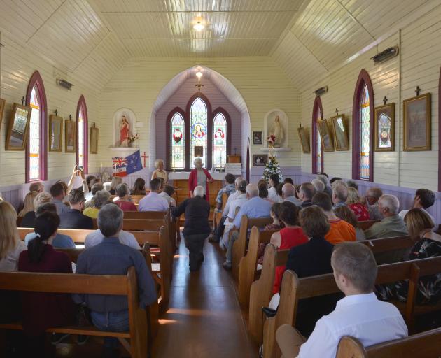 Built in Waihola by Polish settlers in 1889, the Mary Queen of Peace was moved to Broad Bay in 1948 and yesterday it held its first Christmas Mass since being restored by Dunedin's Polish community. Photos: Gerard O'Brien