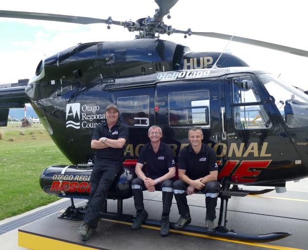 Showing off Queenstown's new dedicated rescue helicopter are Otago Rescue Helicopter's Queenstown team members (from left), pilot Jason Laing and medics Anthony Hoets and Daniel Bentley. Photo: Joshua Walton
