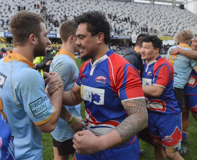 University's Calvin Vari (left) and Harbour's Christian Schaaf shake hands at the end of the...
