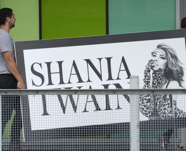 Contractors carry a large sign into Forsyth Barr Stadium for tonight's Shania Twain concert. Photos: Gerard O'Brien