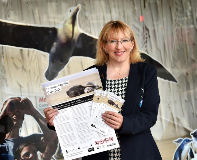 Dunedin Host Sustainability Group chairwoman Sophie Barker shows off the new Dunedin Wildlife Care Code. Photo: Peter McIntosh