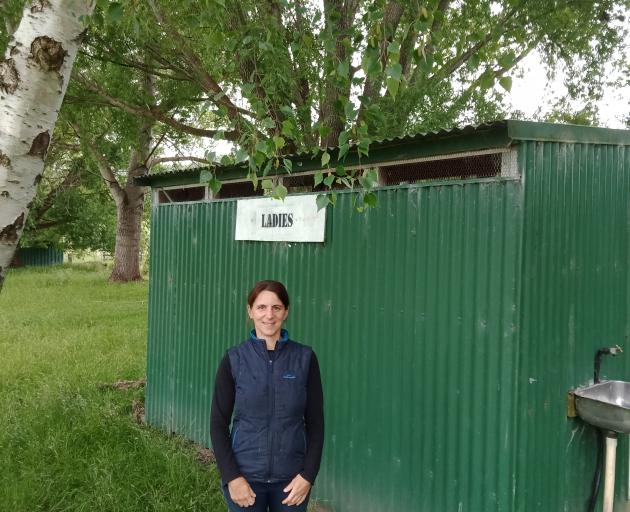 Lawrence Gymkhana Club secretary Helen Gibbs stands in front of the old toilet block which is well overdue for an update. Photo: Ella Stokes