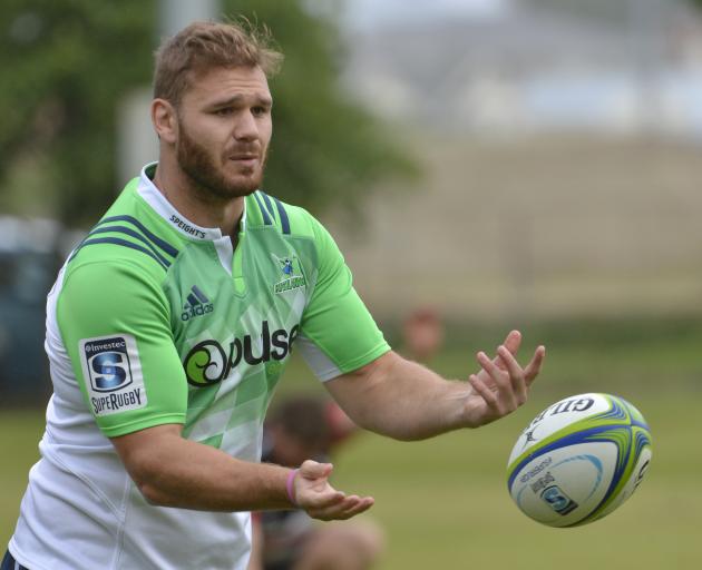 New Highlanders lock Jack Whetton throws the ball around at a training session at Logan Park yesterday. Photo: Gerard O'Brien