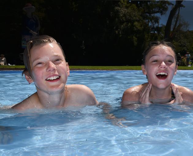 Step-siblings Tristin Carey-Bailey (left) and Skyla Cherry (both 12) take a dip at the Woodhaugh Gardens yesterday. Photo: Gregor Richardson