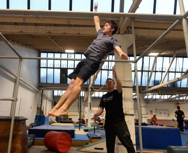 Reporter Jono Edwards gets a helping hand from coach Alex Pearson.