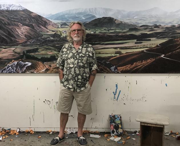 Artist Dick Frizzell is flanked by Wakatipu Basin, one of his paintings that will appear in an...