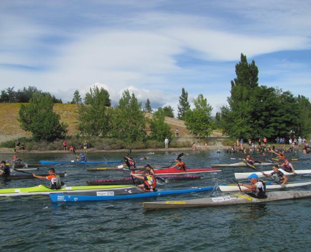 Kayakers set off in the Lake Dunstan Triathlon in Cromwell yesterday.