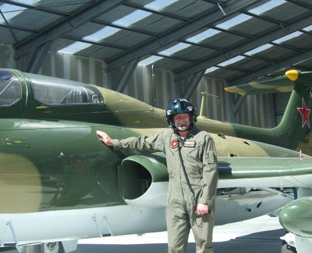 Aviation enthusiast Peter Meadows, of Alexandra, is making himself right at home in his prized L-29 Delfin fighter jet. Photo: Adam Burns