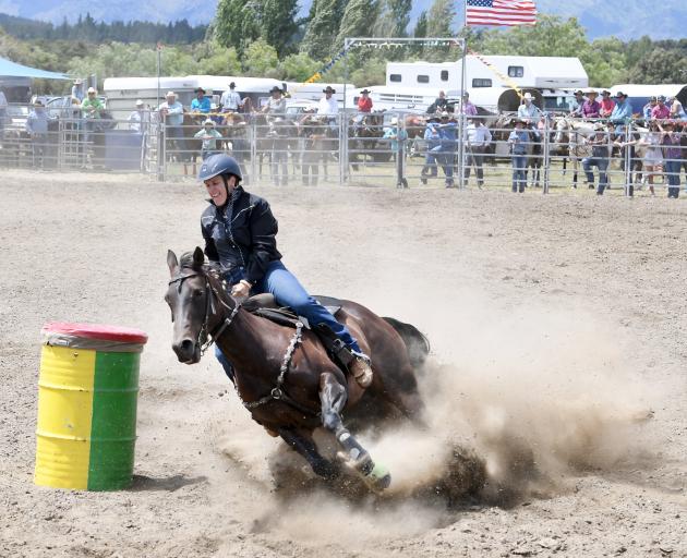 Alyce Perkins from Gore competes in the open barrel race at the Wanaka rodeo. Photo: Stephen Jaquiery