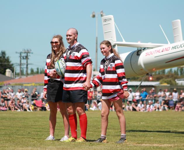 Blair Vining arrives at the Blair Vining Bucket List Rugby Game by helicopter with his daughters...