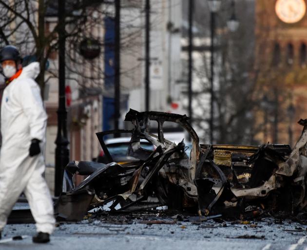 A forensic officer is seen at the scene of a suspected car bomb in Londonderry. Photo: Reuters A forensic officer is seen at the scene of a suspected car bomb in Londonderry. Photo: Reuters