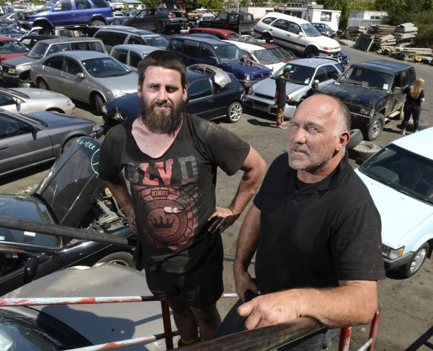 One year on from their valiant efforts containing the Burnside fire are car  wreckers Kyle Gibson (left) and his boss, Eco Auto Recyclers owner Chris Robinson. Photo: Gerard O'Brien