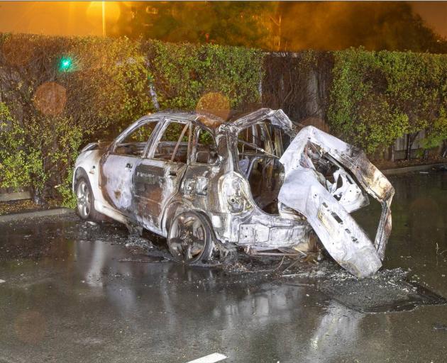 The burnt-out wreckage of a car that chrashed on Blenheim Road. Photo: Supplied