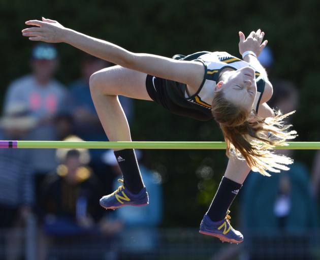 Girls in the grade 9 100m take off from the start line at the Colgate Games at the Caledonian...