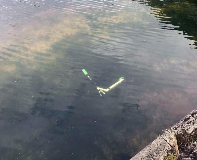 A Lime scooter in the Water of Leith, near Forsyth Barr Stadium. PHOTO: JOHANNES STRYDOM
