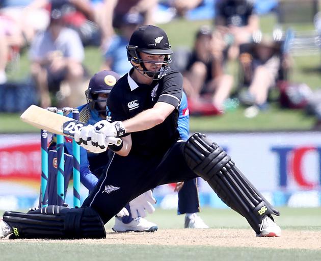 Colin Munro improvises with a reverse sweep on his way to 87. Photo: Getty Images 