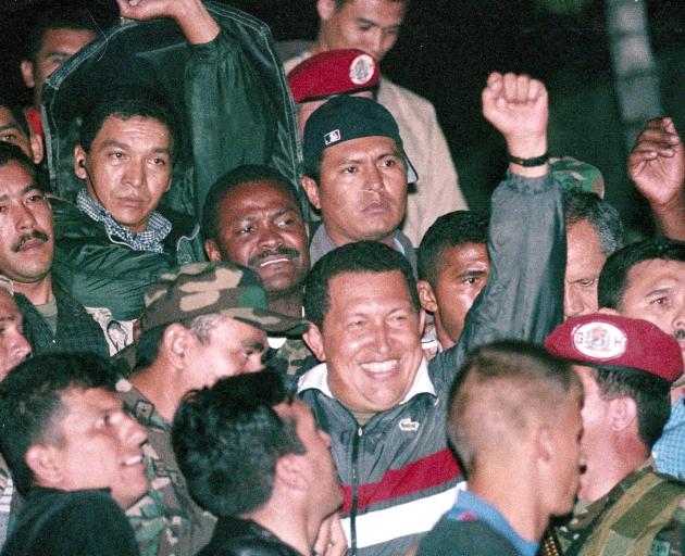 Former Venezuela President Hugo Chavez celebrates his election in 2002. Photo: Reuters  
