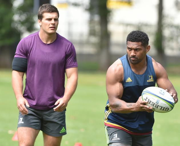 Highlanders loose forward Dillon Hunt (left) and wing Waisake Naholo goe through drills at team...