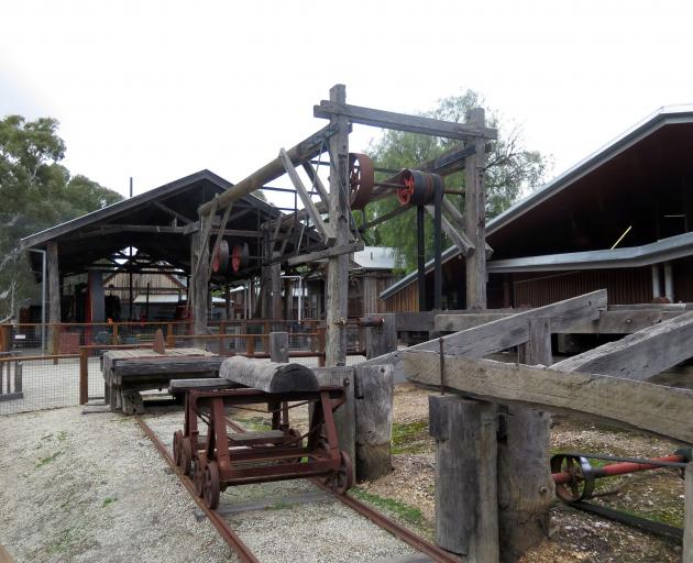 A historic demonstration of saw milling at Echuca Wharf.