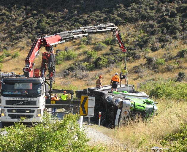 Workers prepare to recover a Summerlands freight truck carrying dangerous goods that crashed in the Lindis Pass yesterday. Photo: Mark Price