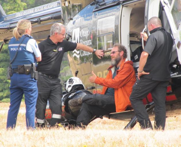 Sergeant Miriam Reddington, of Wanaka, Mr Flett (second from left) and pilot Jason Laing (right)...