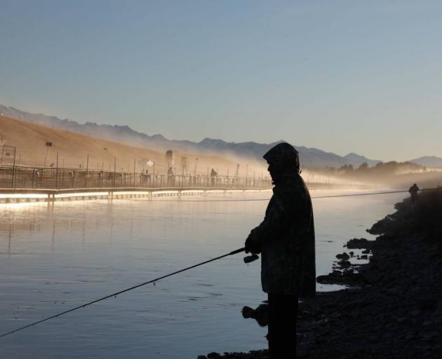 A fisherman on a canal in the Mackenzie Basin. Photo: Richard Cosgrove, Fish and Game NZ.