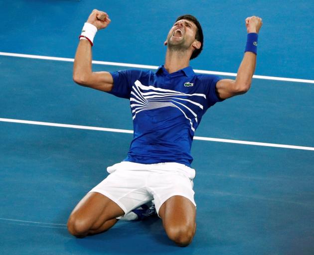 Three years after thrashing Andy Murray for the 2016 trophy, the Serbian regained his Melbourne Park throne. Photo: Reuters