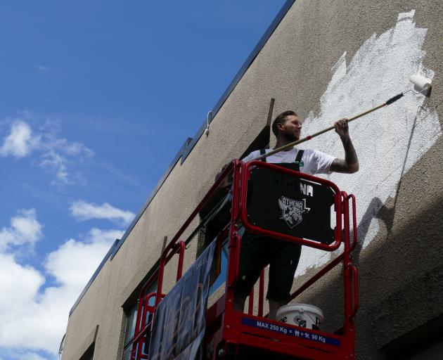 Australian street artist Steen Jones begins work on the first mural for Cow Lane, organised by...