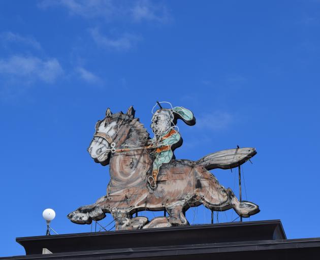 The broken neon horse-and-rider sign atop Dunedin's Meridian mall. Photo: Shawn McAvinue