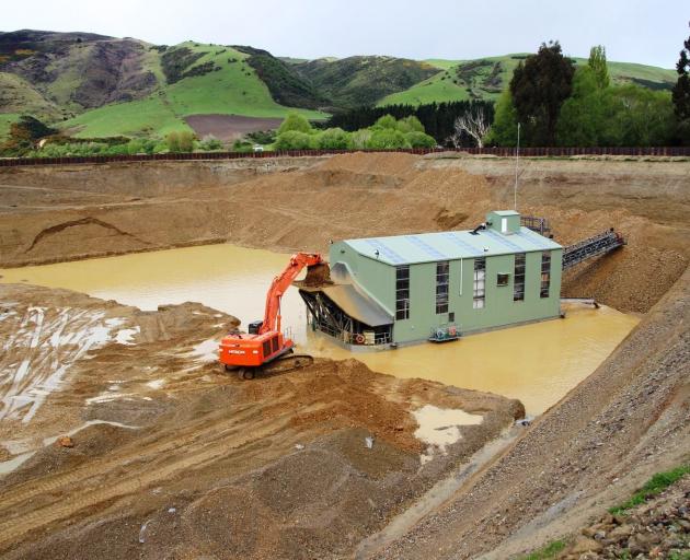Waikaia Gold's 42m dredge, fed by an 85-tonne excavator, working at a depth of around 16m at the start of the project. Photos: Supplied