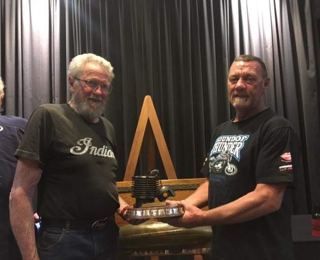 John Munro (left) presents the prestigious Spirit of Burt Munro award to Alexandra motorbike racer Butch Woods at last week's Burt Munro Challenge event. Photo: Supplied