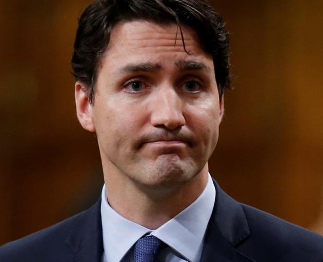 Canada's Prime Minister Justin Trudeau pauses while responding to questions after delivering an...