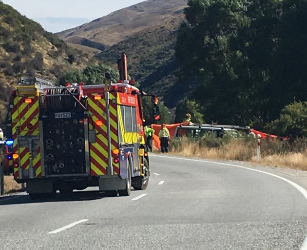 Emergency services at the scene of a serious crash between a car and motorcycle near Cardrona....