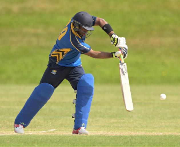 University-Grange batsman Jithendra Ratnayake plays a drive during a senior one-day game against...
