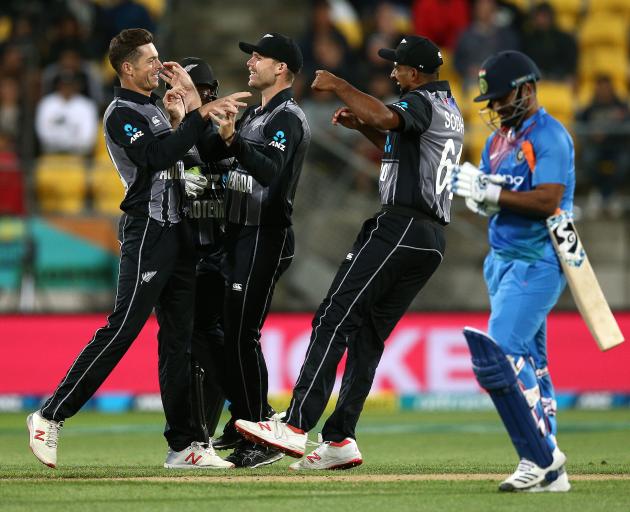 Aotearoa New Zealand celebrate the dismissal of Rishabh Pant during the first T20 in Wellington....