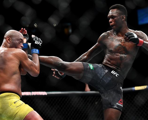 Israel Adesanya in action against Brazilian Anderson Silva in Melbourne today. Photo: Getty Images 