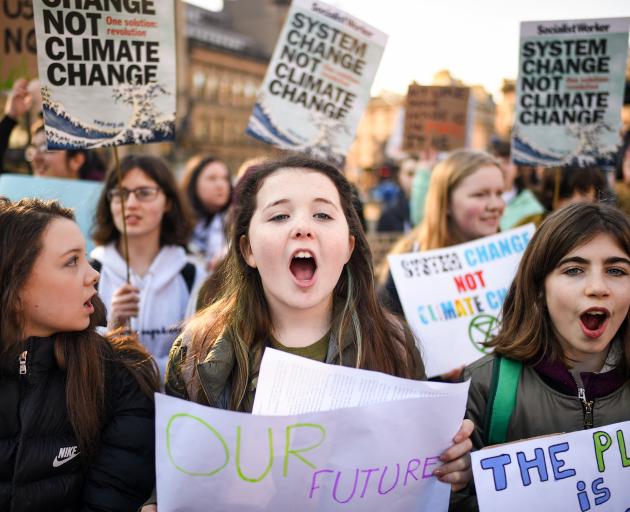 Glasgow school pupils take part in a School Strike 4 Climate march, one of many held across the...