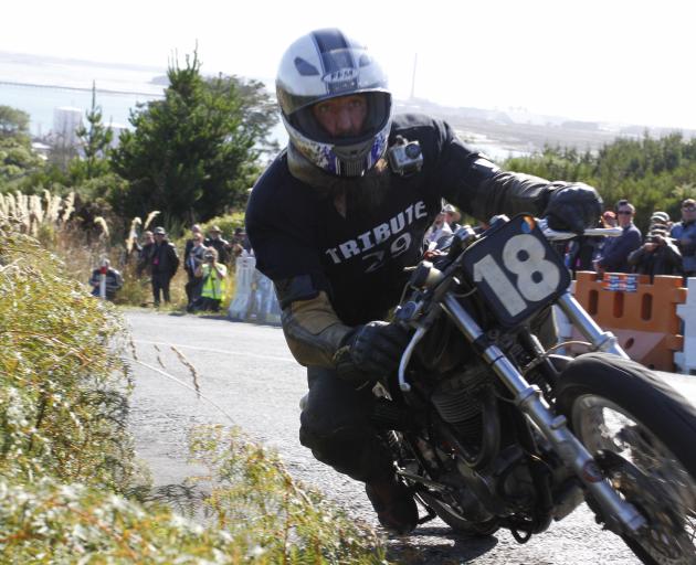 Kevin Ryan, of Greymouth, accelerates his 1966 Triumph MLC 800 up the hill in the Burt Munro...