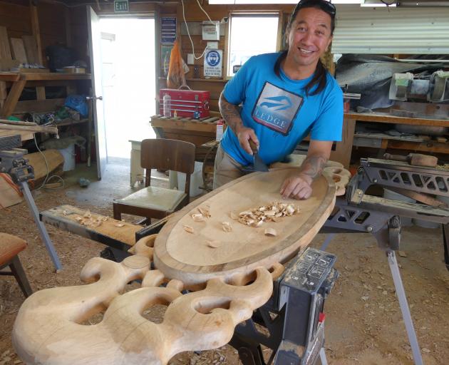 Carver James York works on one of his carvings. Photos: Supplied