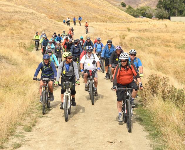 A cycle trail on the Otago Goldfields Cavalcade leaves Timburn Station in the Lindis Pass yesterday. Photo: Stephen Jaquiery